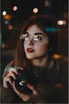 bokeh girl with camera.jpg