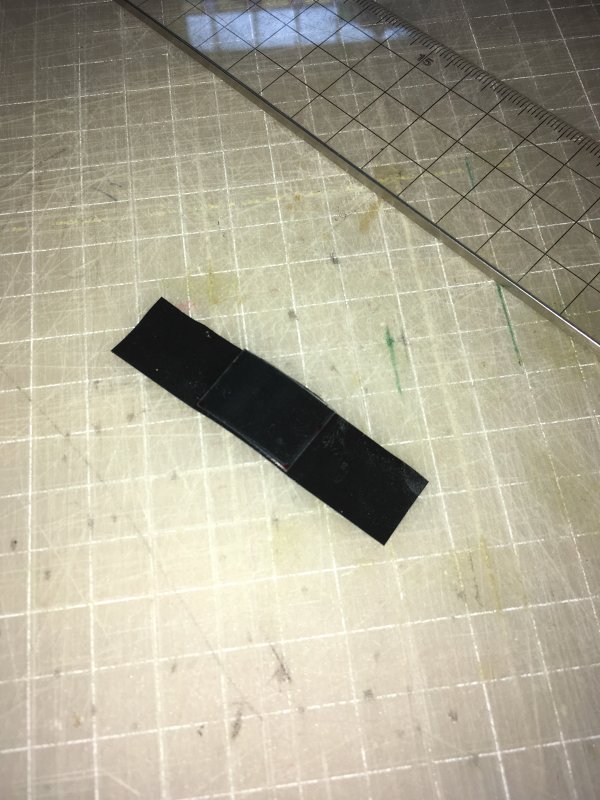 tape and plastic bit from a plastic cup